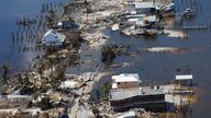 Destroyed homes and businesses on Pine Island, Florida are seen from a U.S. Army National Guard Blackhawk helicopter as U.S. National Guard Bureau Chief General Daniel Hokanson tours the area by air after Hurricane Ian caused widespread destruction on Pine Island, Florida, U.S., October 1, 2022. REUTERS/Kevin Fogarty