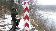 A Polish border guard and his dog overlook the Polish-Russian border near the village of Ostre Bardo, February 1, 2001. The border with Russia&#39;s Kaliningrad enclave, wedged between Poland and Lithuania, is set to become the European Union&#39;s easternmost frontier following Poland&#39;s EU accession around 2004. Russia and the European Union failed to agree May 29, 2002 on visa-free travel for the Kaliningrad enclave when the EU expands eastward, an issue President Vladimir Putin said was a basic post-