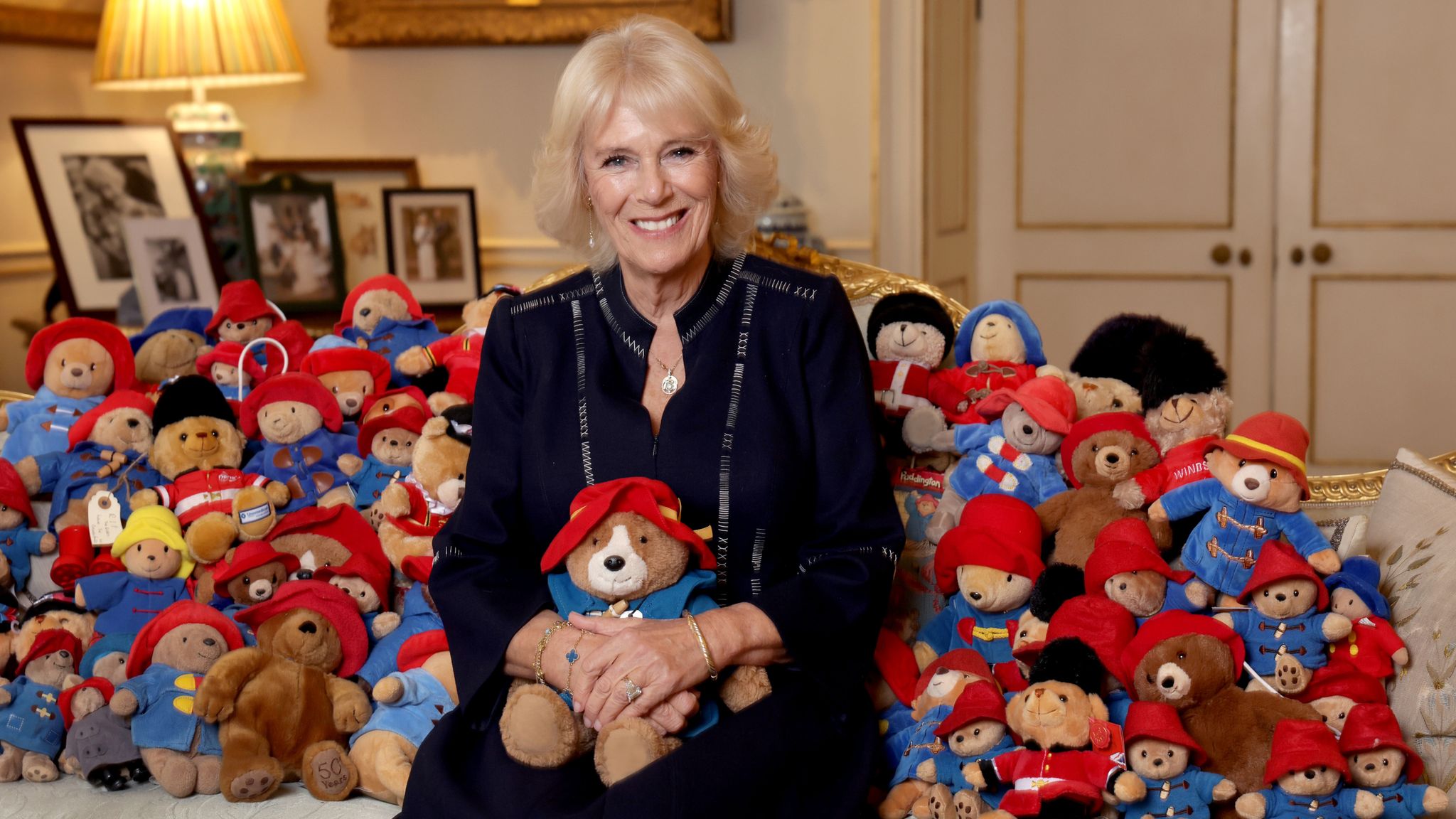 Camilla pictured surrounded by Paddington Bears as tributes to