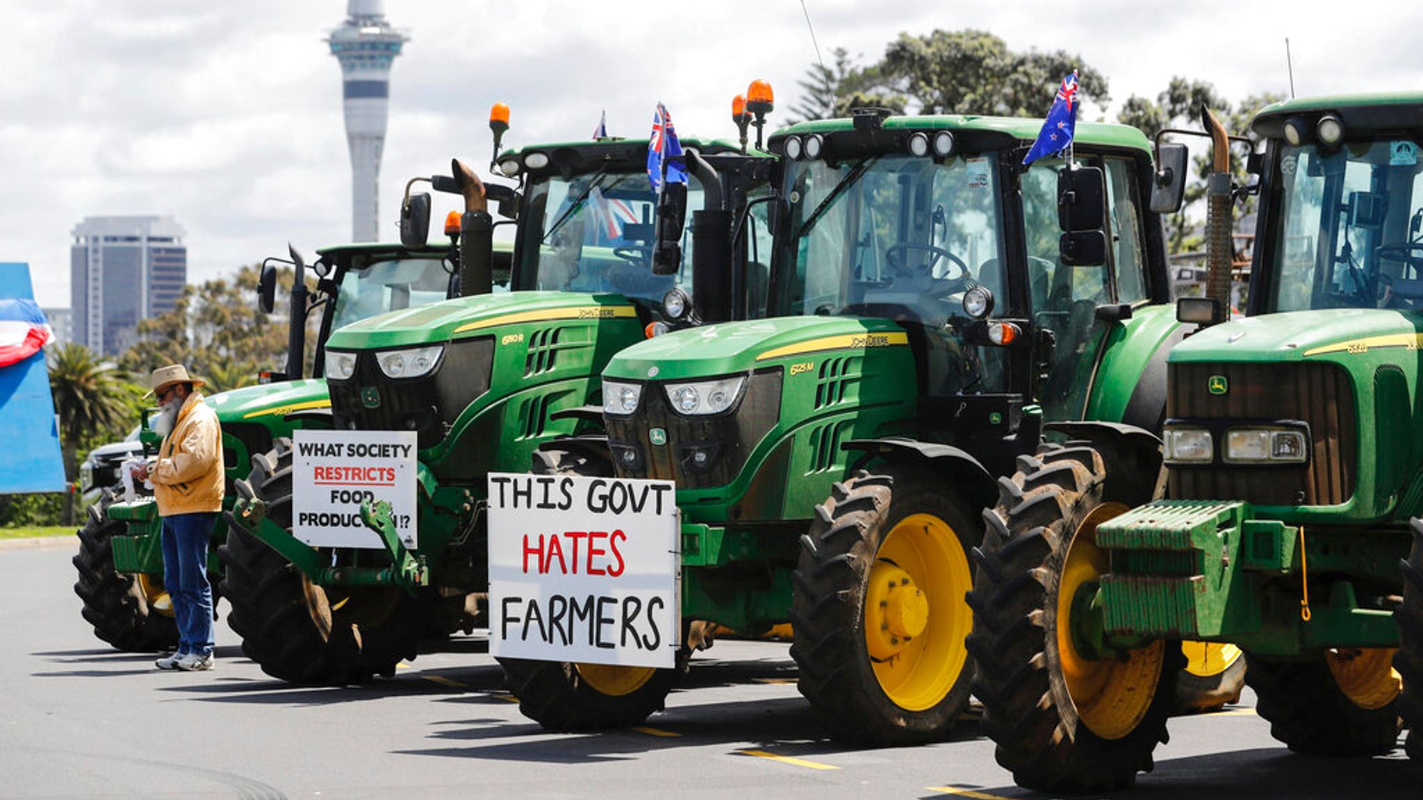 New Zealand farmers drive tractors on motorways to protest 'burp tax