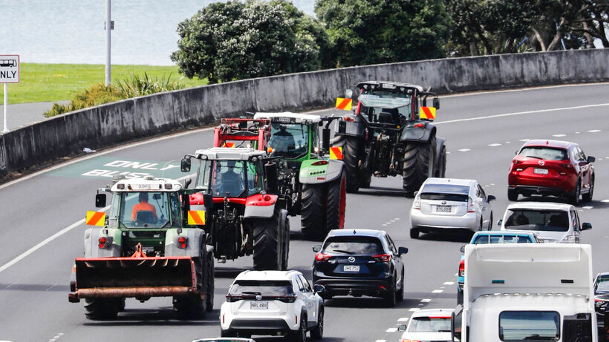 New Zealand farmers drive tractors on motorways to protest 'burp tax