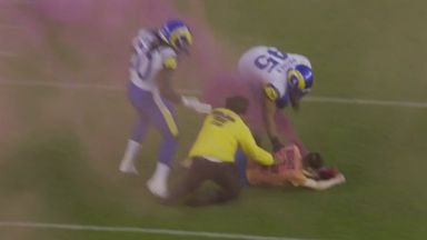 'Get him down!' - Rams linebacker takes down fan on field with big hit