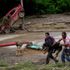 At least 25 killed as landslide tears through Venezuelan town
