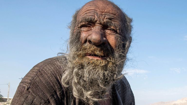 Amou Haji (uncle Haji) is pictured on the outskirts of the village of Dezhgah in the Dehram district of the southwestern Iranian Fars province, on December 28, 2018. - Believed to be the worlds dirtiest man, villagers say that Haji&#39;s leather-like skin hasn&#39;t touched soap and water for more than sixty years. They believe that he decided to live in isolation after suffering from an emotional setback in his youth. (Photo by - / AFP) (Photo by -/AFP via Getty Images)