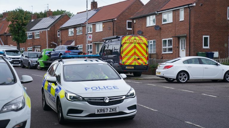 Police vehicles at the scene on Aycliffe Crescent, Gateshead, where a 14-year-old boy was fatally attacked. Picture date: Tuesday October 4, 2022.
