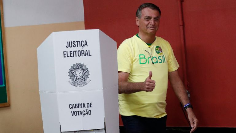 Brazilian President Jair Bolsonaro, who is running for another term, gives a thumbs up after voting in a run-off presidential election in Rio de Janeiro, Brazil, Sunday, Oct. 30, 2022. (AP Photo/Bruna Prado, Pool)