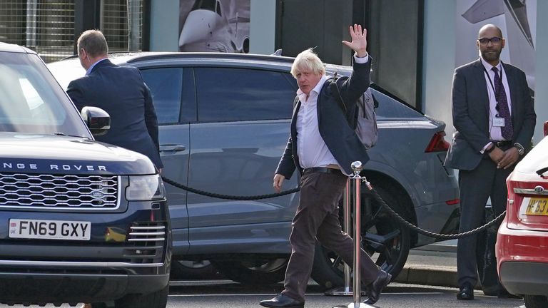 Boris Johnson arrives at Gatwick Airport and waves to the media