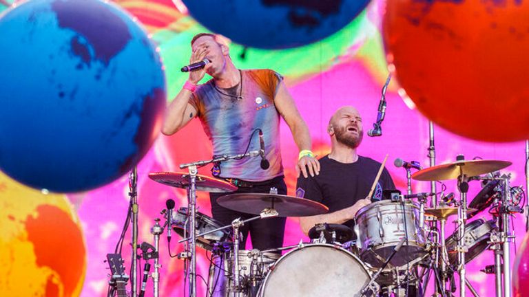 02 July 2022, Hessen, Frankfurt/Main: Chris Martin (l), vocals, piano, rhythm guitar, and Will Campion, drums, percussion, backing vocals, are on stage. The rock group Coldplay gives a concert in the "Deutsche Bank Park". It is the first concert in Germany of the "Music Of The Spheres World Tour". Photo by: Andreas Arnold/picture-alliance/dpa/AP Images




