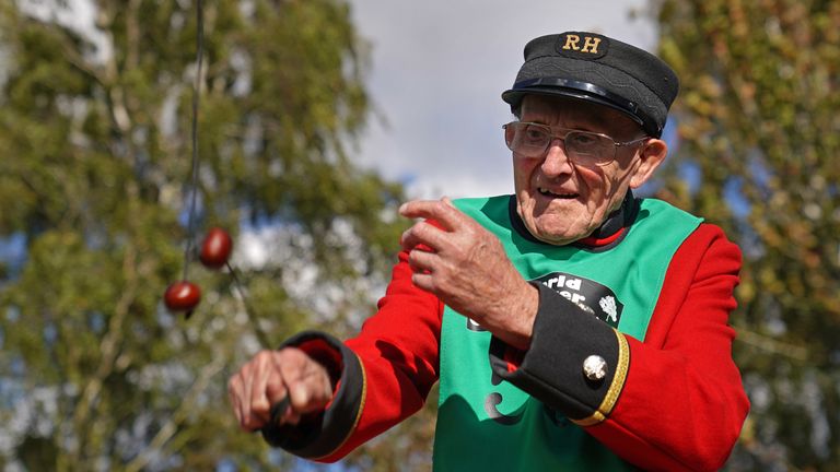 Chelsea pensioner John Riley, 92, (right) takes part in the annual World Conker Championships at the Shuckburgh Arms in Southwick, Peterborough. Picture date: Sunday October 9, 2022.
