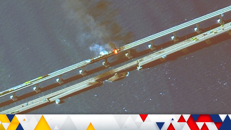 This infrared satellite image provided by Maxar Technologies shows damage to the Kerch Bridge, which connects the Crimean Peninsula with Russia crossing a strait between the Black Sea and the Sea of Azov, and rail cars on fire on Saturday, Oct. 8, 2022. (Maxar Technologies via AP)