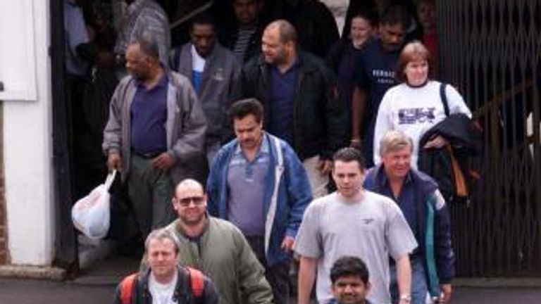 Ford workers leave the Dagenham plant after job losses were announced in 2000
