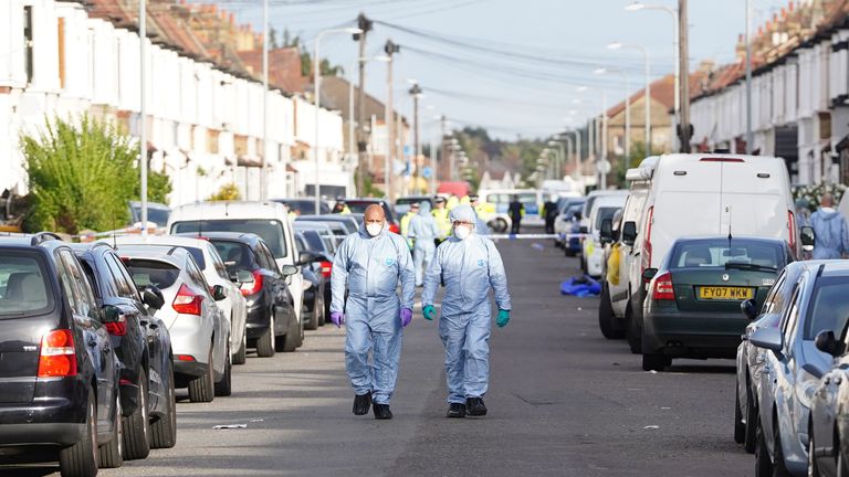 Forensics officers at the scene in Ilford after two men died and a third was left critically injured after a shooting. Picture date: Tuesday October 25, 2022.
