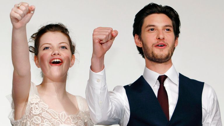 Actress Georgie Henley, left, and Actor Ben Barnes react during Japan premiere of  "The Chronicles of Narnia: The Voyage of the Dawn Treader" in Tokyo,  Sunday, Feb. 13, 2011. (AP Photo/Shizuo Kambayashi)