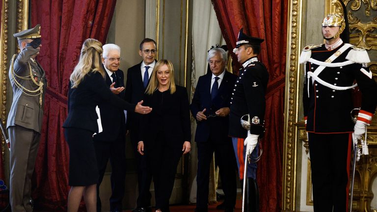 Ms Meloni and Italian President Sergio Mattarella (left) arrive at the swearing-in ceremony 