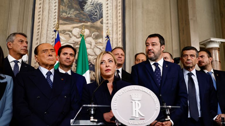 Brothers of Italy leader Giorgia Meloni speaks to the media as she stands next to Forza Italia leader and former Prime Minister Silvio Berlusconi and League party leader Matteo Salvini, following a meeting with Italian President Sergio Mattarella at the Quirinale Palace in Rome, Italy October 21, 2022. REUTERS/Yara Nardi
