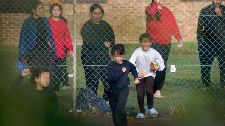 A view of people thought to be migrants at the Manston immigration short-term holding facility located at the former Defence Fire Training and Development Centre in Thanet, Kent. 