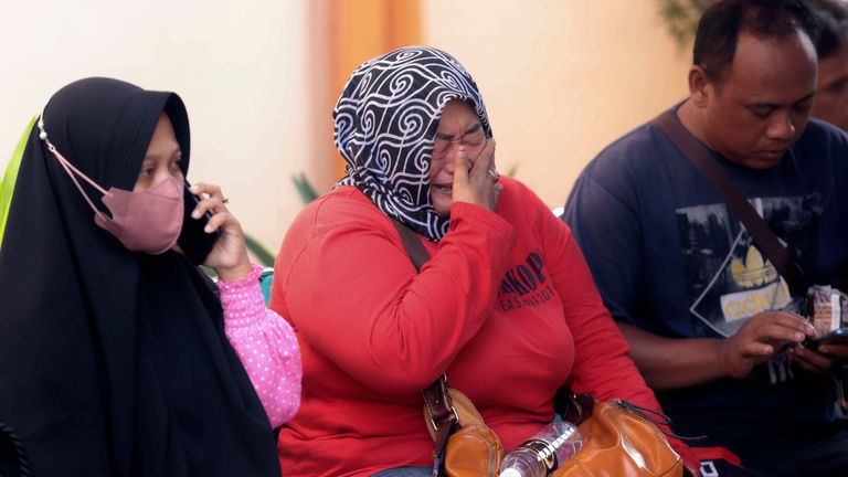 Pic: AP A relative of a victim in the soccer stampede cries as she waits at the Saiful Anwar Hospital in Malang, East Java, Indonesia, Sunday, Oct. 2, 2022. Panic at an Indonesian soccer match after police fired tear gas to to disperse supporters invading the pitch left over 100 people dead, mostly trampled to death, police said Sunday. (AP Photo/Trisnadi)