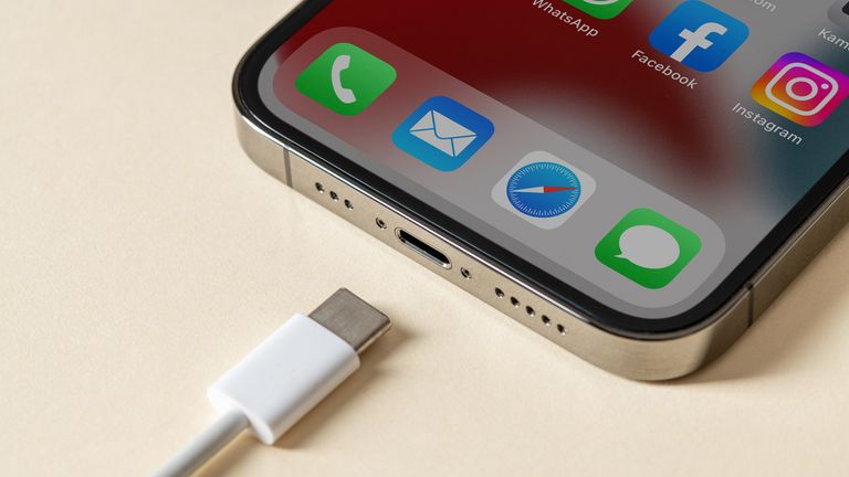 Antalya, Türkiye - June 10, 2022.  Apple Iphone 13 Pro and USB-c or Type-C wired charger. The European Union forces all devices to use USB-C or Type-C