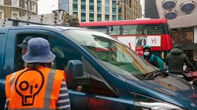 The motorist was telling protesters to 'move out of the way' so he could drive his partner to hospital