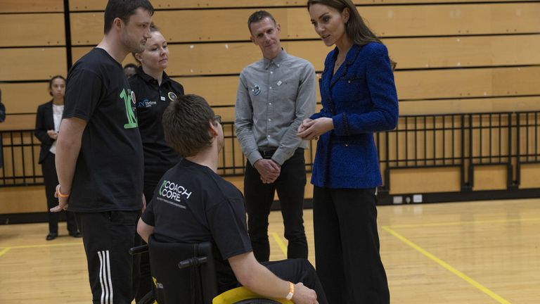 The Princess of Wales speaks to Scott Cooper (in wheelchair) during a visit the Copper Box Arena in the Queen Elizabeth Olympic Park, east London, to take part in an event with Coach Core, which is celebrating its 10th anniversary. Picture date: Thursday October 13, 2022.