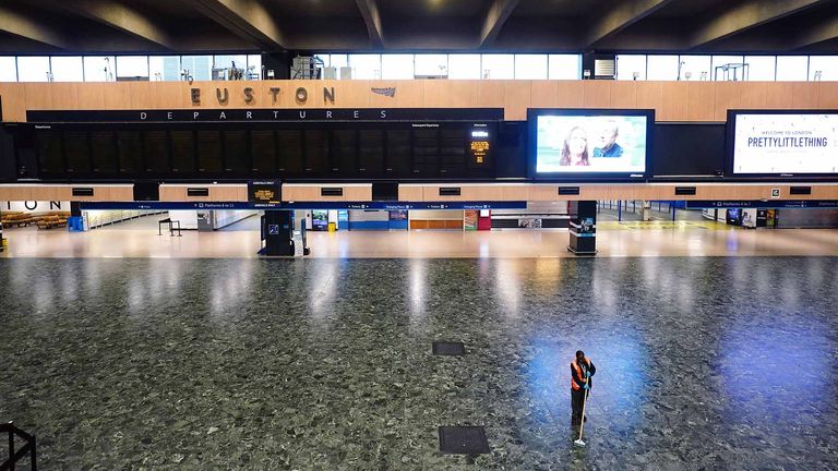 A person sweeping the floor in front of an empty departures board at Euston  station in London, as members of the drivers&#39; union Aslef and the Transport Salaried Staffs Association (TSSA) go on strike. Picture date: Wednesday October 5, 2022.