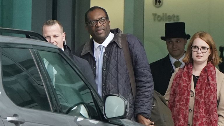 Chancellor of the Exchequer Kwasi Kwarteng (second left) arrives at London Heathrow Airport after travelling on a flight from the US ahead of schedule for urgent talks with Prime Minister Liz Truss as expectations grow that they will scrap parts of their mini-budget to reassure markets. Picture date: Friday October 14, 2022.