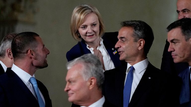 British Prime Minister Liz Truss, center top, speaks with Greece&#39;s Prime Minister Kyriakos Mitsotakis, third right, and Malta&#39;s Prime Minister Robert Abela, second left, at a group photo during a meeting of the European Political Community at Prague Castle in Prague, Czech Republic, October 6, 2022. Alastair Grant/Pool via REUTERS