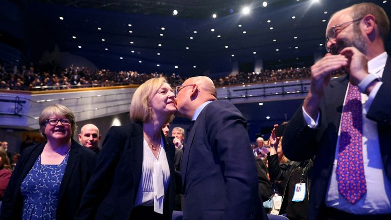 British Prime Minister Liz Truss and Chancellor of the Duchy of Lancaster Nadhim Zahawi kiss as they attend Britain&#39;s Conservative Party&#39;s annual conference in Birmingham, Britain, October 3, 2022. REUTERS/Hannah McKay