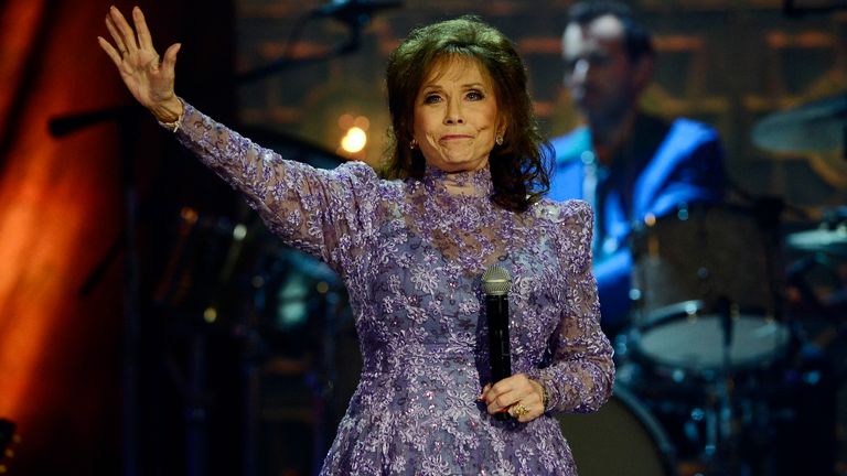 Loretta Lynn waves to the crowd after performing during the Americana Music Honors and Awards show Wednesday, Sept. 17, 2014, i