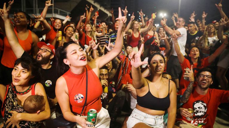 Supporters of Brazil&#39;s former President and presidential candidate Luiz Inacio Lula da Silva gesture at a gathering on the day of the Brazilian presidential election run-off, in Sao Paulo, Brazil October 30, 2022. REUTERS/Carla Carniel