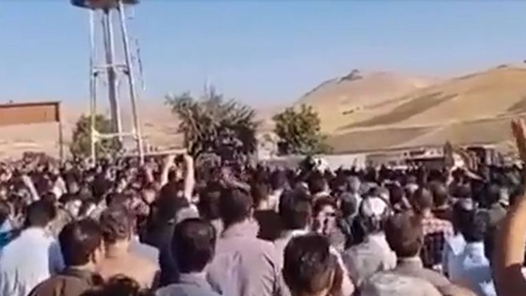 Huge crowds gather for Amini's funeral in her hometown of Saqqez in Iran's Kurdish region