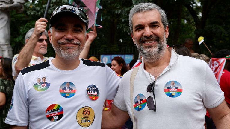 Marcos Oliveira (L) and his friend professor Ariel Silva