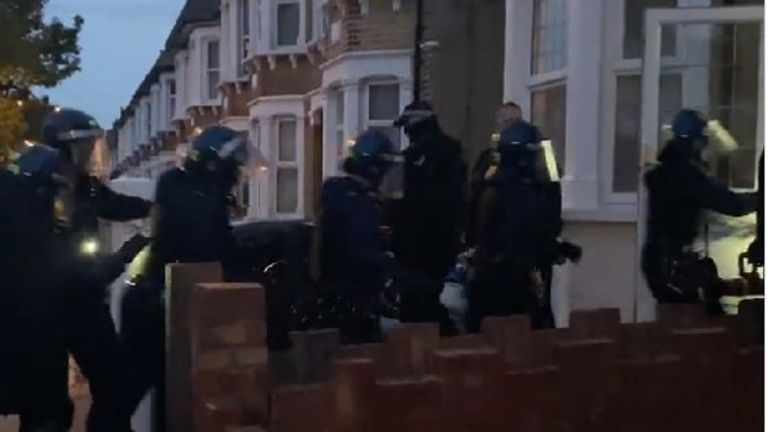 Police raiding a property suspected to be linked to a county lines operation Pic: Twitter/ Met Police 