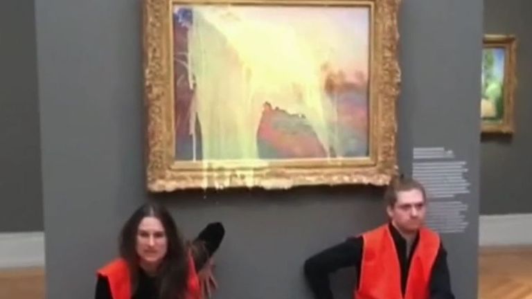 Climate protesters throw mashed potatoes over Monet . painting