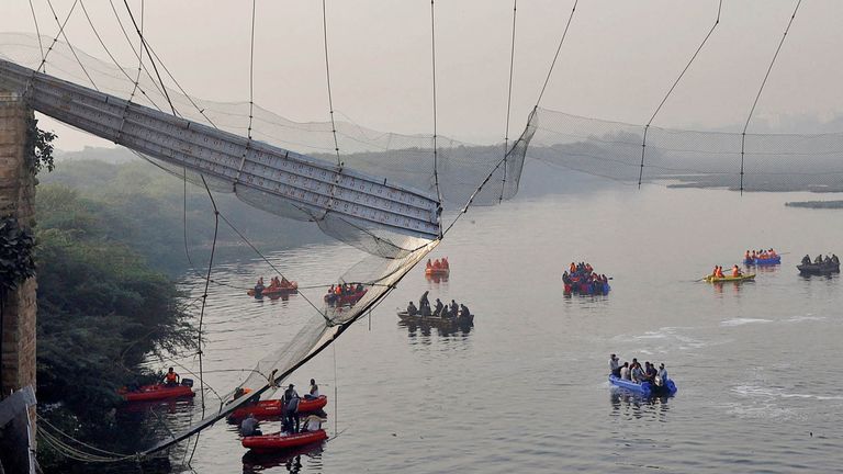 Rescuers search for survivors after a suspension bridge collapsed in Morbi town in the western state of Gujarat, India, October 31, 2022. REUTERS/Stringer NO RESALES. NO ARCHIVES.     TPX IMAGES OF THE DAY     