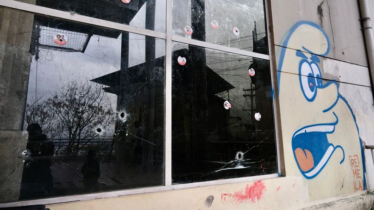 Bullet holes in a window in the Morro da Providencia favela