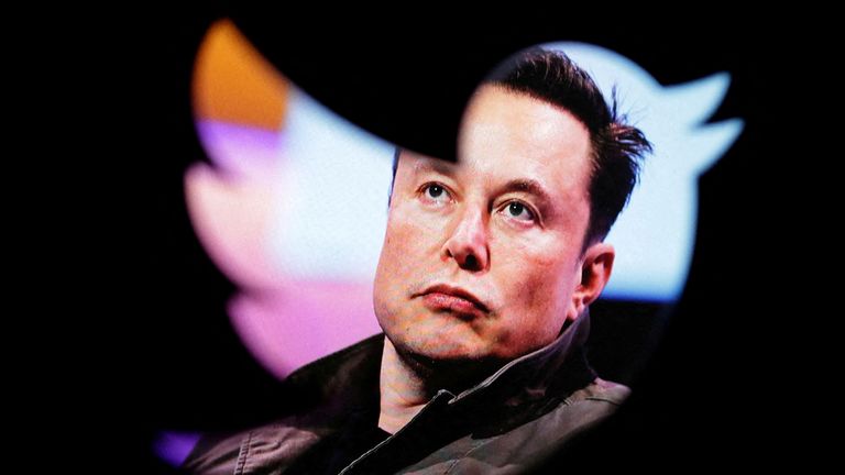 FILE PHOTO: In this illustration taken Oct. 28, 2022, a photo of Elon Musk is seen through the Twitter logo.  REUTERS/Dado Ruvic/Illustration/File Photo