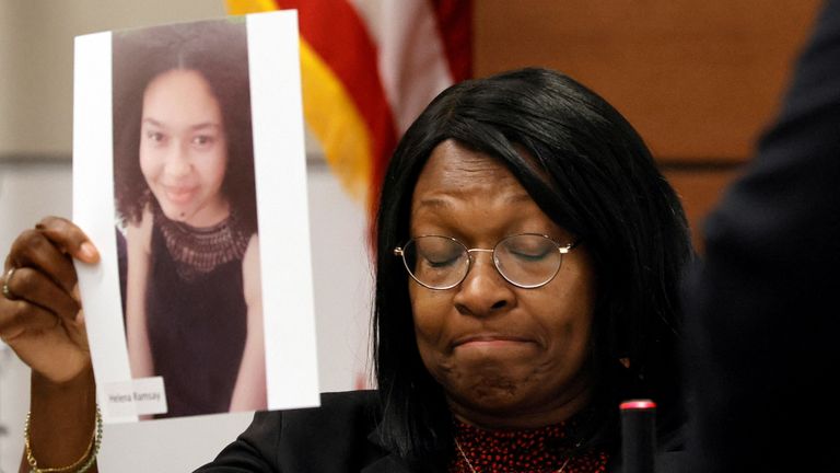 Anne Ramsay holds a picture of her daughter, Helena