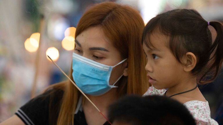 Paweenuch Supolwong and her mother pictured at a Buddhist ceremony at a temple in north-eastern Thailand Pic: AP 