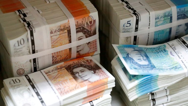 FILE PHOTO: Wads of British Pound Sterling banknotes are stacked in piles at the Money Service Austria company's headquarters in Vienna, Austria, November 16, 2017. REUTERS/Leonhard Foeger/File Photo