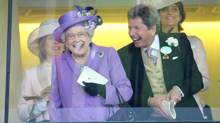 Queen Elizabeth II with her racing manager John Warren at Ascot Racecourse in 2013
