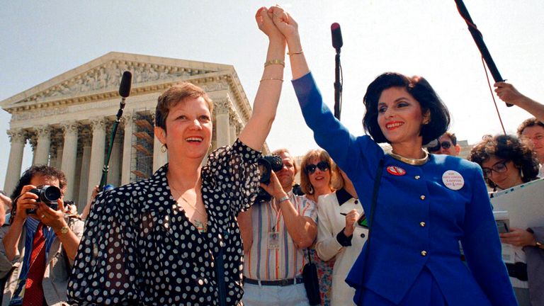 Norma McCorvey, Jane Roe in the 1973 court case, left, and attorney Gloria Allred at the Supreme Court in Washington after sitting in while the court listened to arguments in a Missouri abortion case.   McCorvey died at an assisted living center in Katy, Texas on Saturday, Feb. 18, 2017, said journalist Joshua Prager, who is working on a book about McCorvey and was with her and her family when she died. He said she died of heart failure.(AP Photo/J. Scott Applewhite, File)