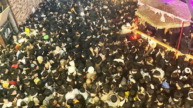 A street in Seoul&#39;s Itaewon district is pictured full of people before a stampede during Halloween festivities