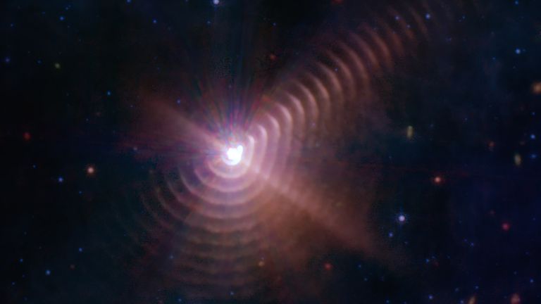 EMBARGOED TO 1601 WEDNESDAY OCTOBER 12 Undated handout photo issued by NASA of a new image from the James Webb Space Telescope showing at least 17 dust rings resembling a fingerprint created by a rare type of star and its companion, locked in a celestial dance. Issue date: Wednesday October 12, 2022.