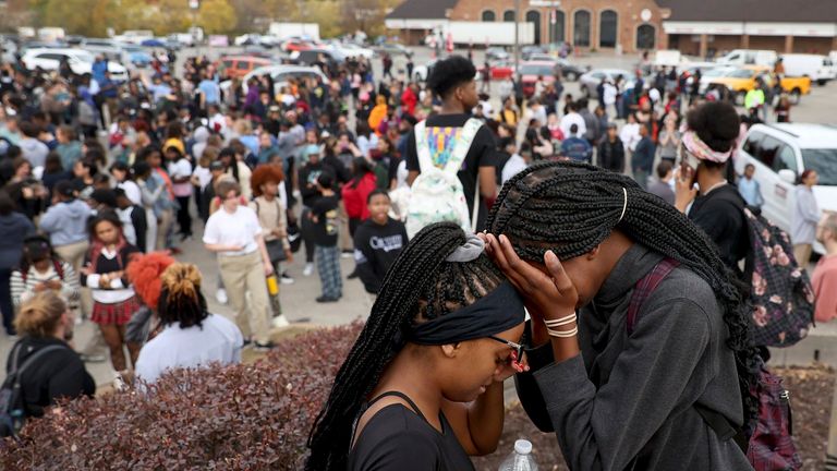 Students stand in a parking lot near the Central Visual & Performing Arts High School after a reported shooting at the school in St. Louis on Monday, Oct. 24, 2022. (David Carson/St. Louis 
PIC:AP