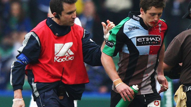 LONDON - APRIL 12: Tom Williams of Harlequins is replaced by team mate Nick Evans (not in picture) as blood pours from his mouth during the Heineken Cup Quarter Final match between Harlequins and Leinster at the Stoop on April 12, 2009 in Twickenham, England.  (Photo by David Rogers/Getty Images)