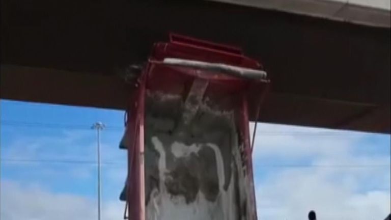 part of a truck becomes wedged under a bridge in Ontario