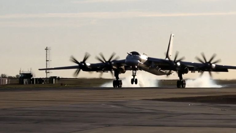 A still image from a video released by the Russian Defense Ministry shows what it is believed to be a Russian Tu-95MS strategic bomber landing during an exercise organized by the country's strategic nuclear forces at an unknown location