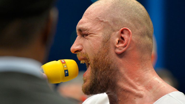 Fury is famous for holding a mic in the ring.  Photo: AP