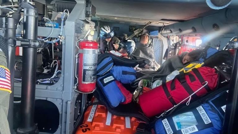 Two injured men were hoisted into the helicopter. Image: U.S. Coast Guard Heartland/Facebook